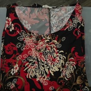 Womenswear black, white and red blouse. Comes from home with no pets or smokers